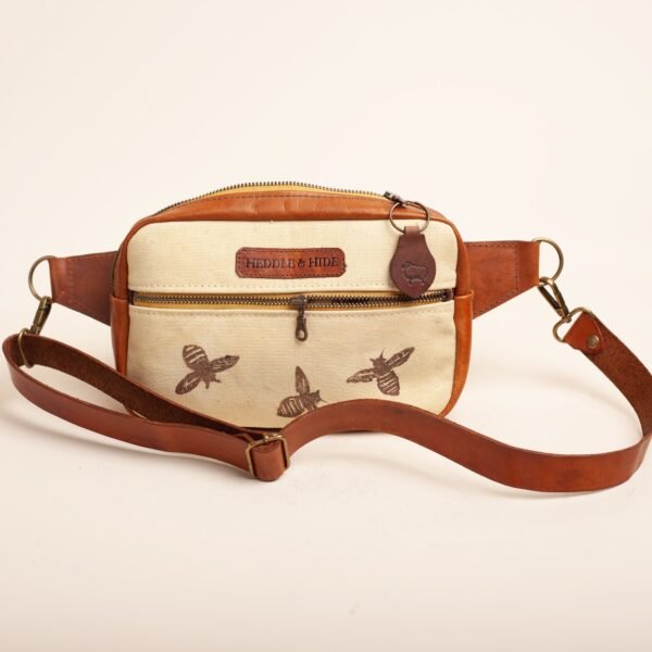 a fanny pack in leather and hand printed bee pattern