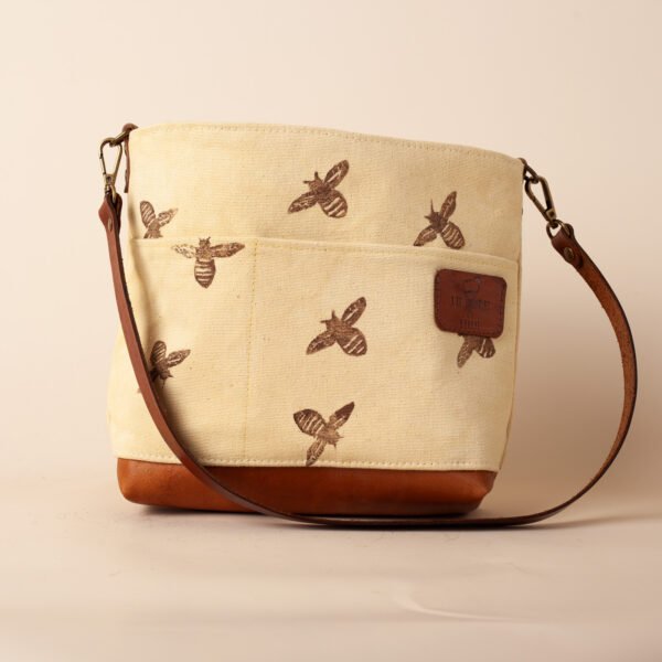 a mini tote in brown leather and bee print