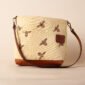 a mini tote in brown leather and bee print