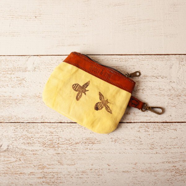 a pouch in canvas and leather printed with bees