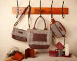 a collection of handwoven brown and white houndstooth bags