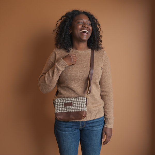 happy woman wearing the houndstooth crossbody bag