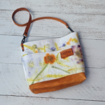 mini tote bag with leather and botanically printed flowers in a bright spring theme
